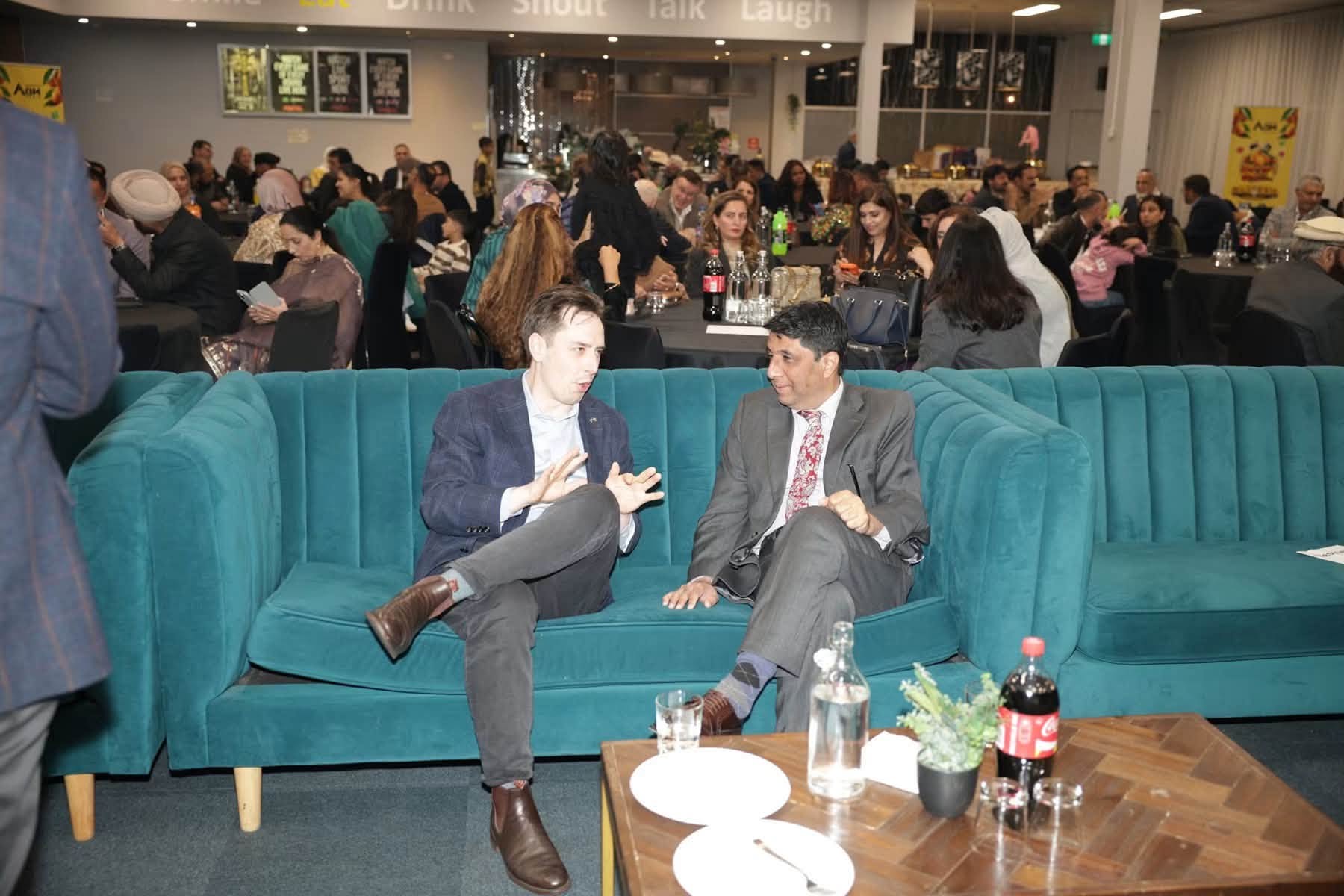 Guests in candid conversation at the Mango Mela launch, Canberra